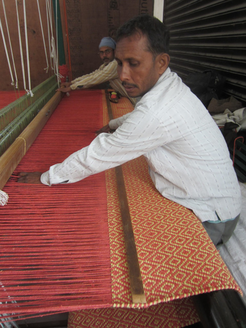 A pair of our skilled weavers hard at work.